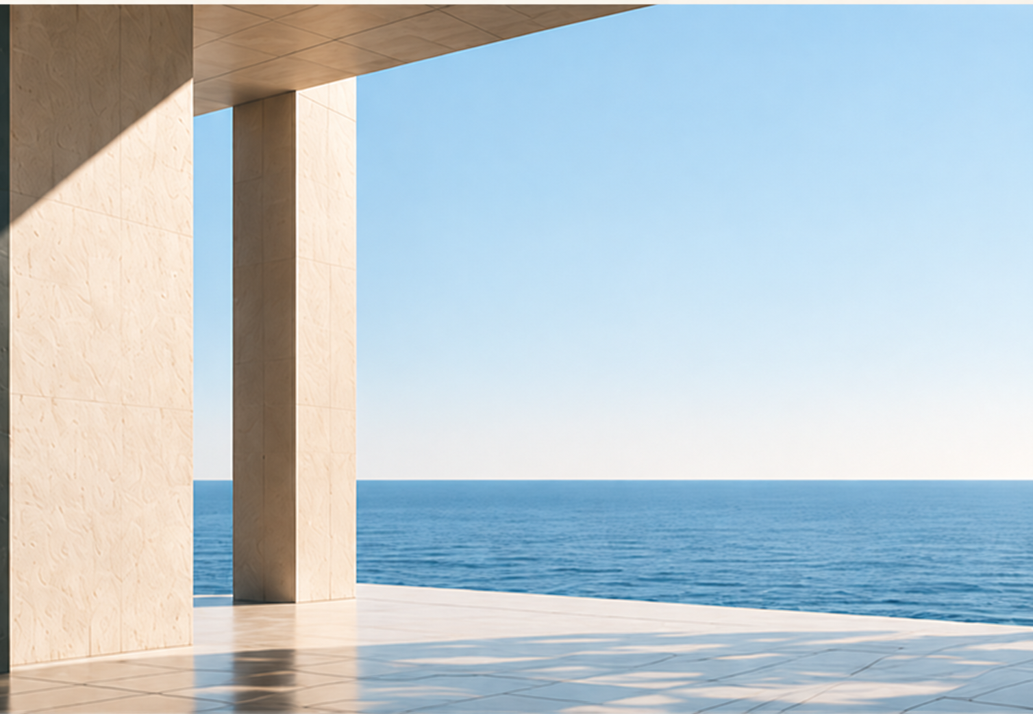 Sunlit stone architecture opening towards the sea